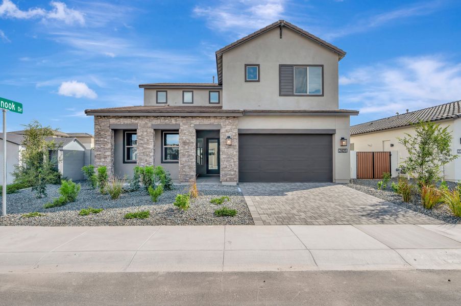 Front exterior of a new home in Soleo, San Tan Valley, AZ, highlighting curb appeal (Image 2). Front exterior of a new home in Soleo, San Tan Valley, AZ, highlighting curb appeal (Image 2).