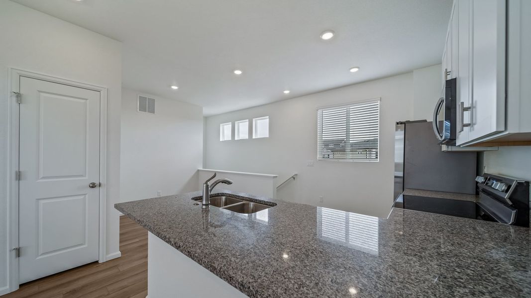 Furnished interior view inside a new home in Reunion, Commerce City (Image 4).