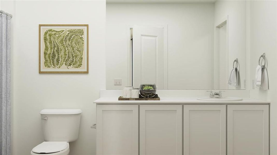 Bathroom featuring toilet and vanity