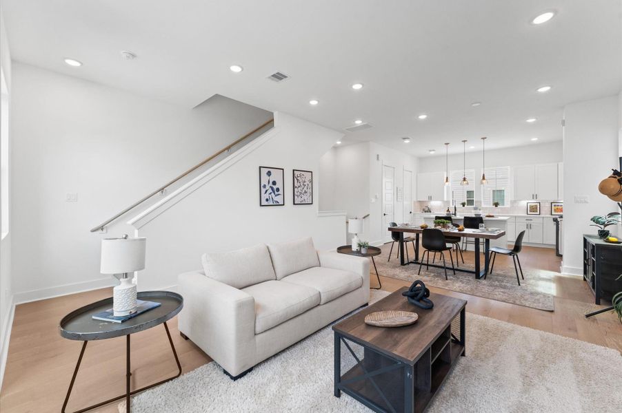 Designed for modern living, this open-concept space seamlessly unites the kitchen, dining, and living areas into one harmonious hub.
