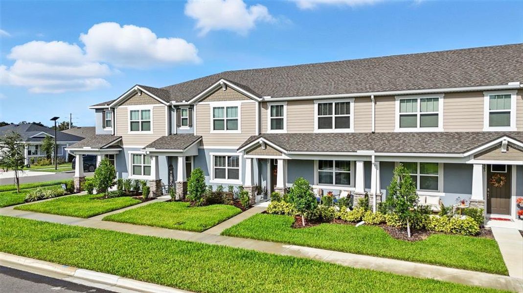 Front exterior of a new home in Waterbrooke, Clermont, FL, highlighting curb appeal (Image 21). Front exterior of a new home in Waterbrooke, Clermont, FL, highlighting curb appeal (Image 21).