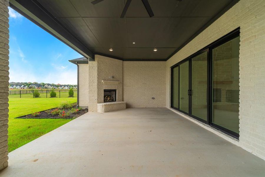 View of patio / terrace with an outdoor brick fireplace