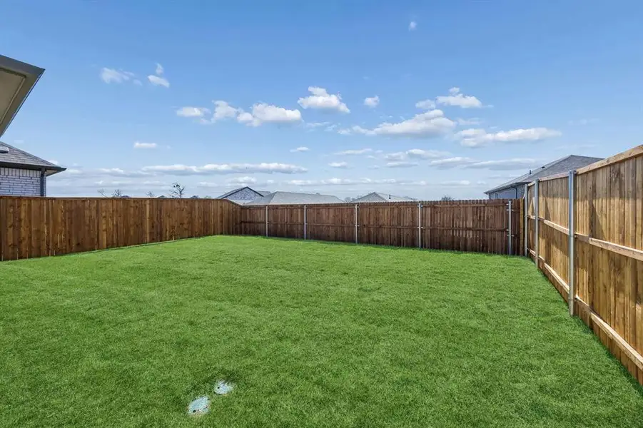 Covered Patio in the Mesquite home plan by Trophy Signature Homes – REPRESENTATIVE PHOTO