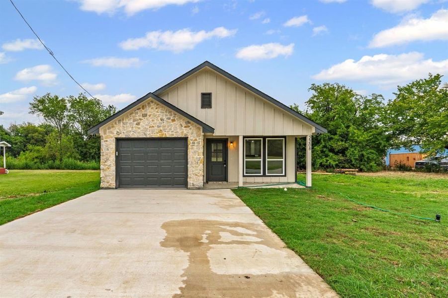 Front exterior of a new home in , Greenville, TX, highlighting curb appeal (Image 25). Front exterior of a new home in , Greenville, TX, highlighting curb appeal (Image 25).
