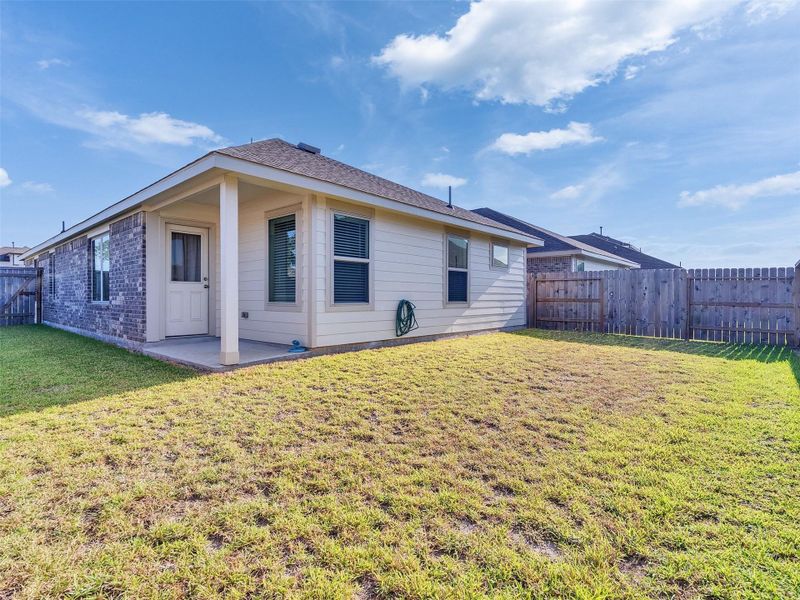 Exterior details and patio area of a home in Tavola: Gulf Coast Collection, New Caney (Image 19).