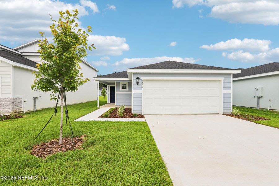 Front exterior of a new home in Kings Crossing, Jacksonville, FL, highlighting curb appeal (Image 17). Front exterior of a new home in Kings Crossing, Jacksonville, FL, highlighting curb appeal (Image 17).