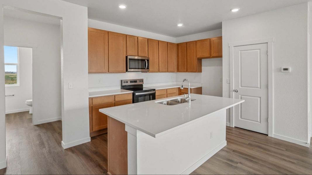 Kitchen with cabinetry, countertops, island, and modern finishes. Kitchen with cabinetry, countertops, island, and modern finishes.