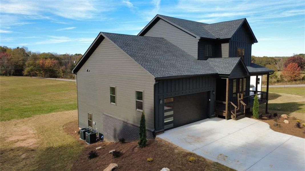 Front exterior of a new home in , Snellville, GA, highlighting curb appeal (Image 22).