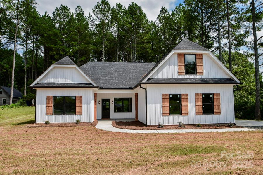 Front exterior of a new home in , Marshville, NC, highlighting curb appeal (Image 19).