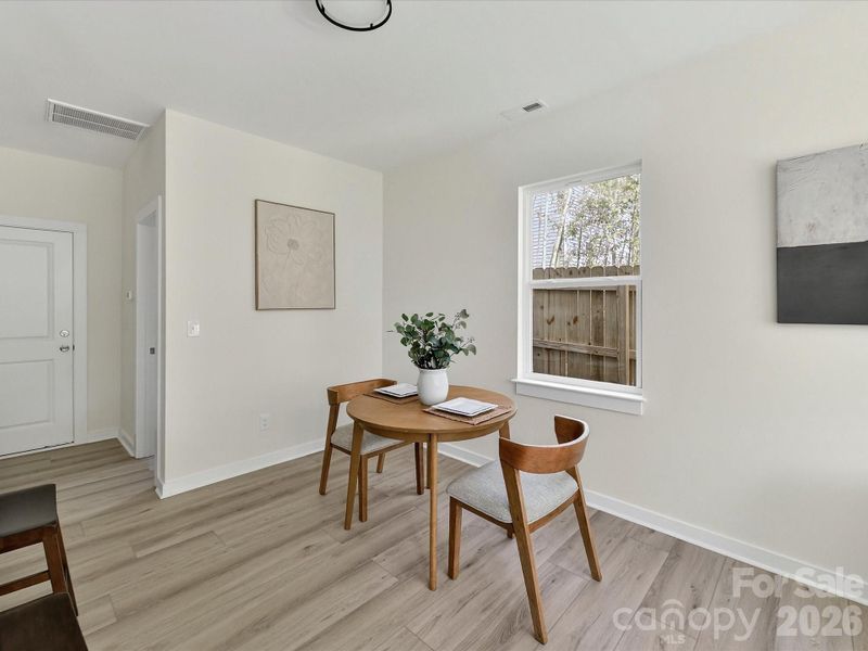 Bright and cozy breakfast nook with abundant natural light, offering the perfect spot for casual dining and morning coffee.