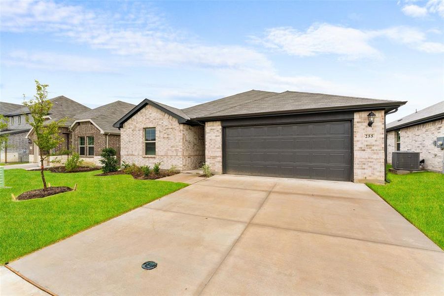 View of front of house with brick siding, concrete driveway, a garage, and a front yard View of front of house with brick siding, concrete driveway, a garage, and a front yard