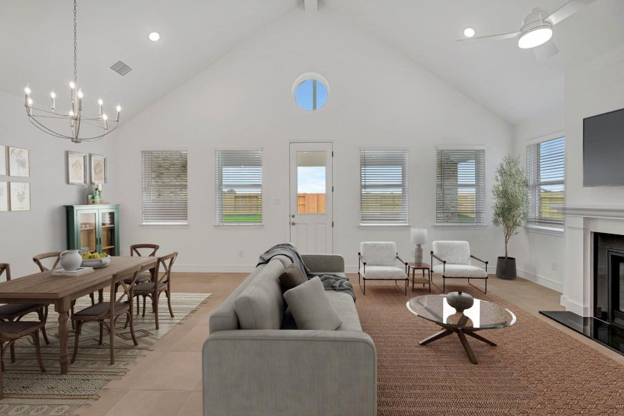 Open great room and dining area with cozy fireplace