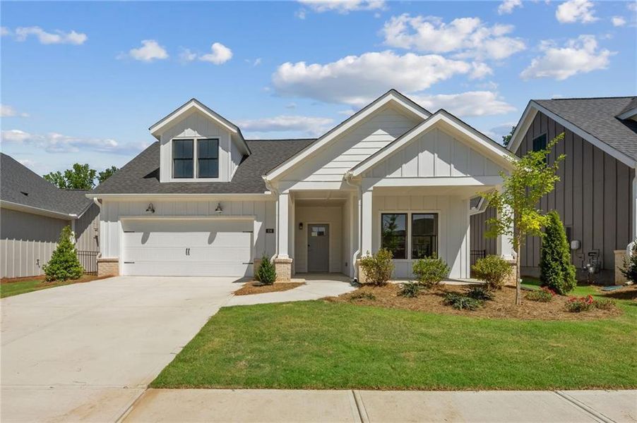 Front exterior of a new home in The Courtyards at Redbud Lane, Canton, GA, highlighting curb appeal (Image 13).