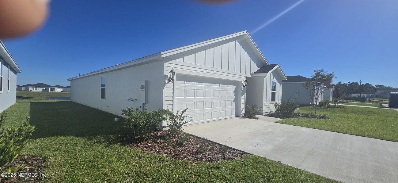 Exterior details and patio area of a home in Lakes at Bella Lago - Signature Series, Green Cove Springs (Image 21). Exterior details and patio area of a home in Lakes at Bella Lago - Signature Series, Green Cove Springs (Image 21).