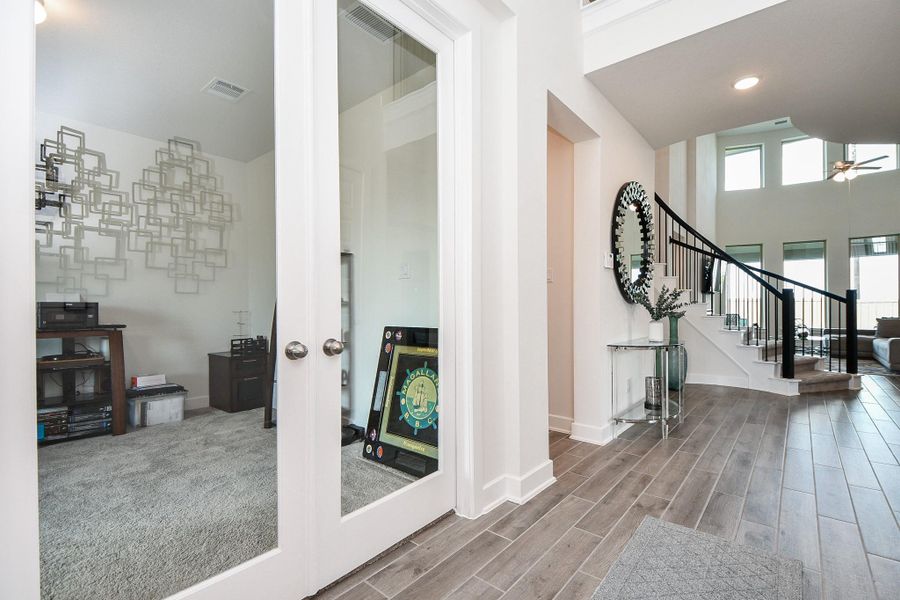 Here's the view as you enter the home, facing the stunning staircase and incredible living area, ahead. Here's the view as you enter the home, facing the stunning staircase and incredible living area, ahead.