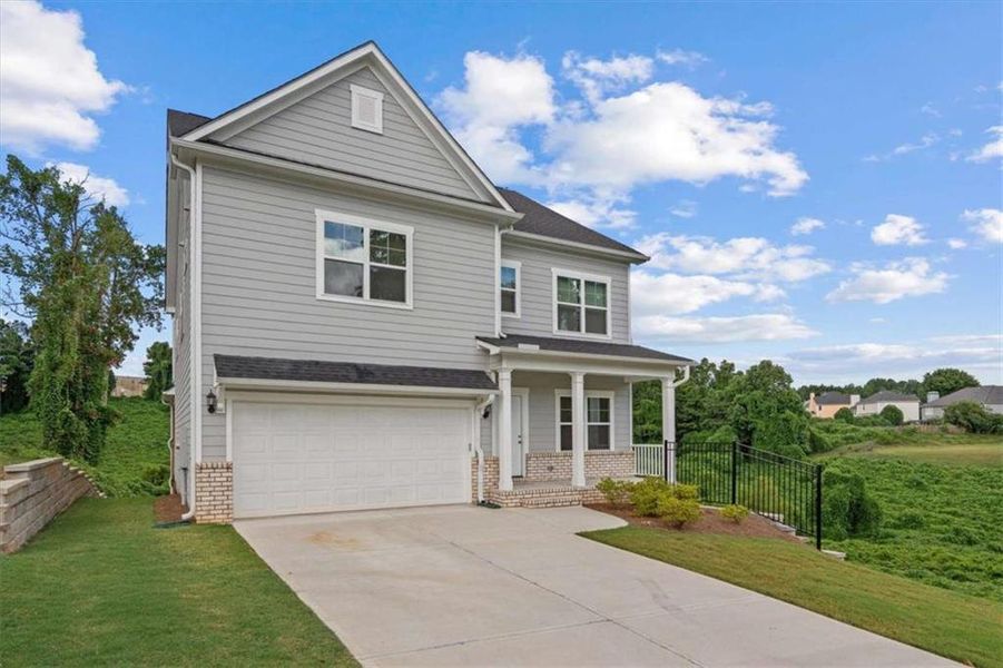 Front exterior of a new home in , Villa Rica, GA, highlighting curb appeal (Image 1).