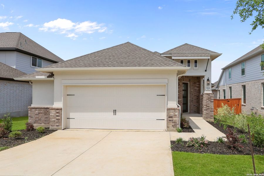 Front exterior of a new home in Veramendi, New Braunfels, TX, highlighting curb appeal (Image 21).