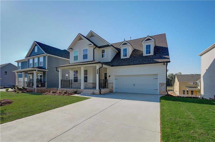 Front exterior of a new home in Cooper Park, McDonough, GA, highlighting curb appeal (Image 2). Front exterior of a new home in Cooper Park, McDonough, GA, highlighting curb appeal (Image 2).