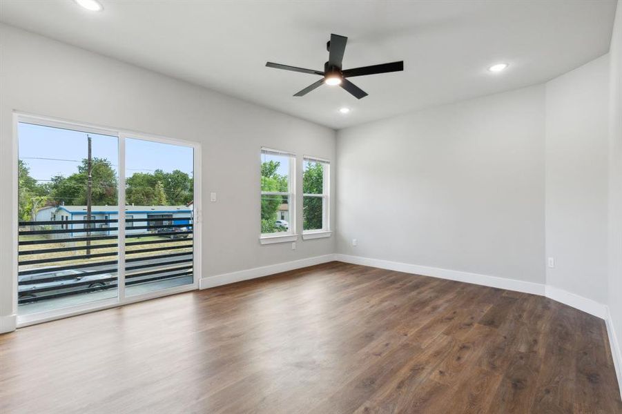 Spare room featuring ceiling fan and dark hardwood / wood-style floors