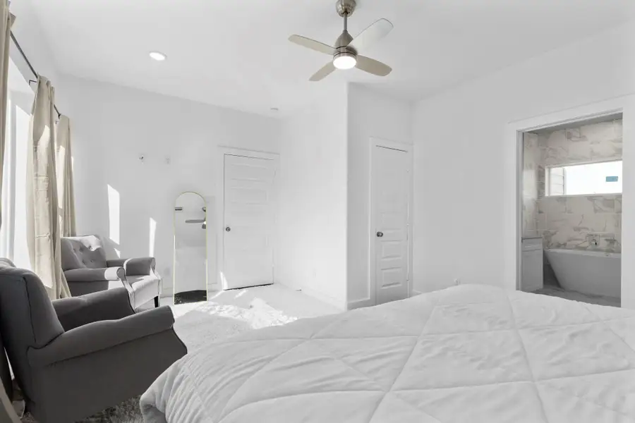 Luxurious primary suite perfect for rest and rejuvenation.