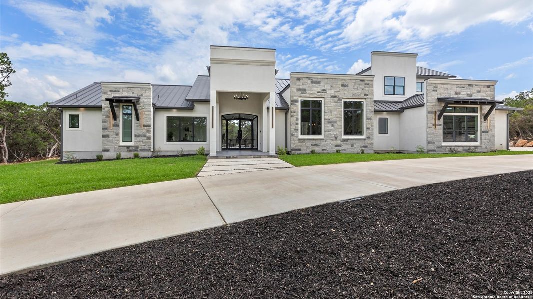 Front exterior of a new home in , San Antonio, TX, highlighting curb appeal (Image 1).