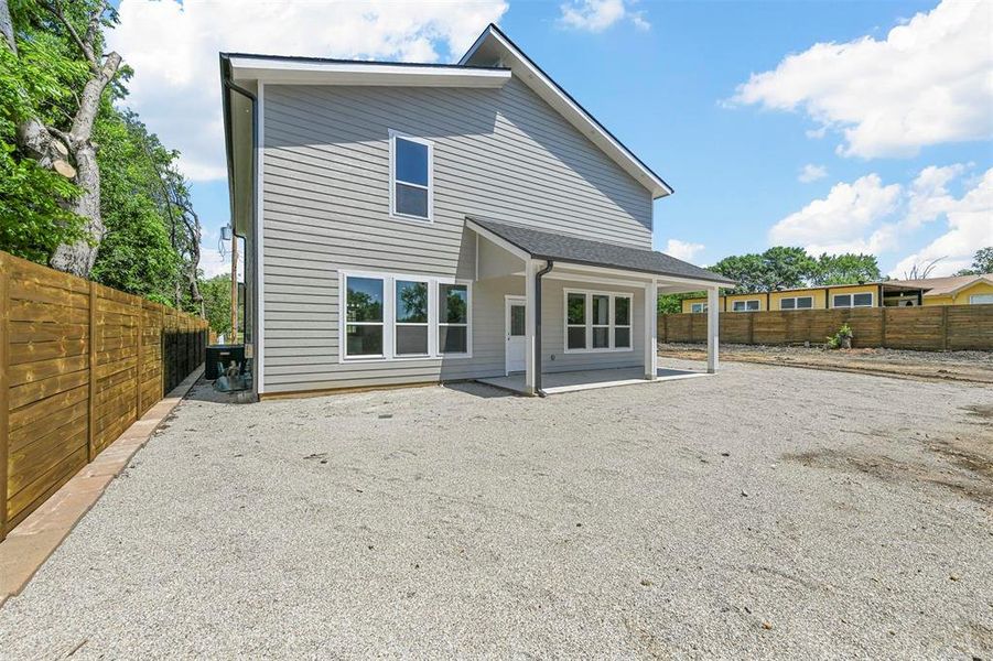 Rear view of property with a patio