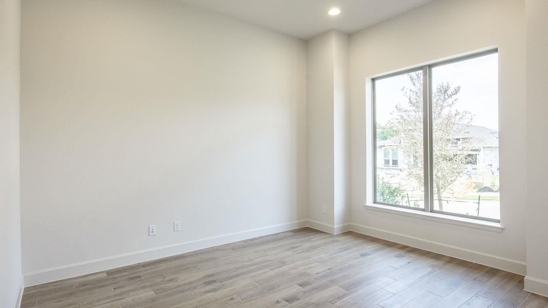 Spacious, unfurnished interior of a new home in Parkside on the River West, Georgetown (Image 13).