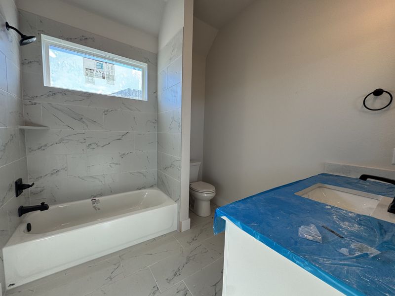 In-progress construction of a new home in Coyote Crossing, Godley, TX (Image 15).