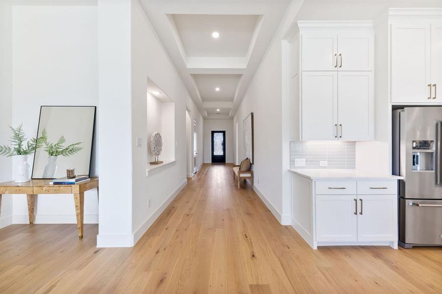 Offering a dramatic entrance with ample space to display art work, welcome into your dream home!