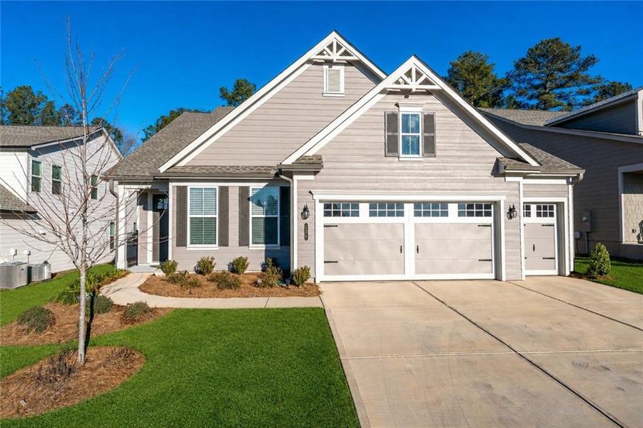 Front exterior of a new home in , Hoschton, GA, highlighting curb appeal (Image 25).
