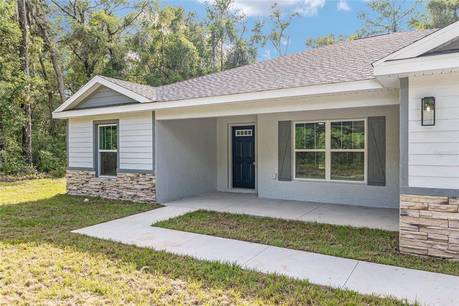 Front exterior of a new home in , Dunnellon, FL, highlighting curb appeal (Image 2).