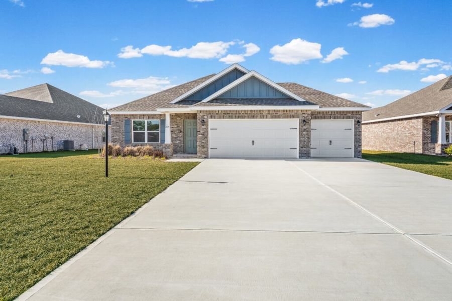 Front exterior of a new home in Lake Merial, Panama City, FL, highlighting curb appeal (Image 1). Front exterior of a new home in Lake Merial, Panama City, FL, highlighting curb appeal (Image 1).