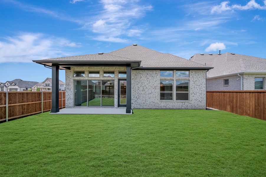 Exterior details and patio area of a home in Sandbrock Ranch, Aubrey (Image 3). Exterior details and patio area of a home in Sandbrock Ranch, Aubrey (Image 3).