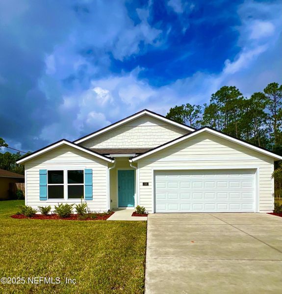 Front exterior of a new home in Palm Coast Homesites, Palm Coast, FL, highlighting curb appeal (Image 1).