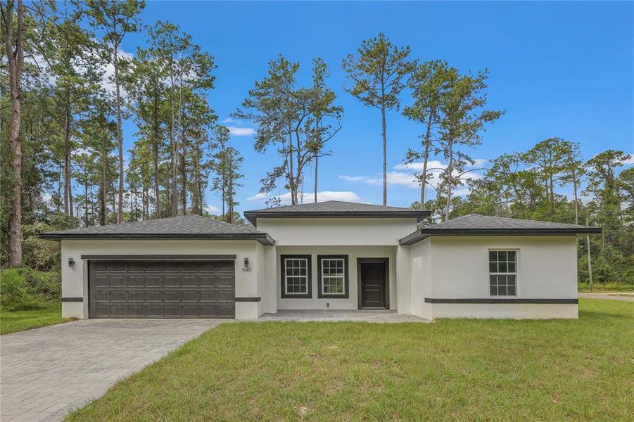 Front exterior of a new home in , Ocala, FL, highlighting curb appeal (Image 22). Front exterior of a new home in , Ocala, FL, highlighting curb appeal (Image 22).