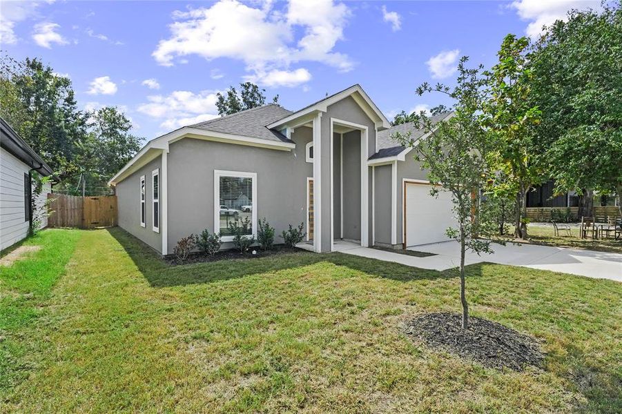Ranch-style house with concrete driveway, stucco siding, roof with shingles, and a garage Ranch-style house with concrete driveway, stucco siding, roof with shingles, and a garage