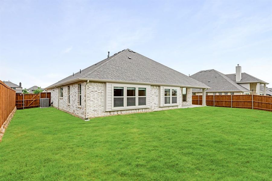 Front exterior of a new home in Rockwood 65, Mansfield, TX, highlighting curb appeal (Image 24).