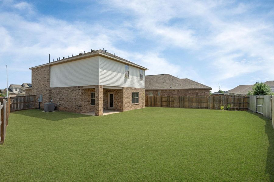 Exterior details and patio area of a home in Sunterra, Katy (Image 3).