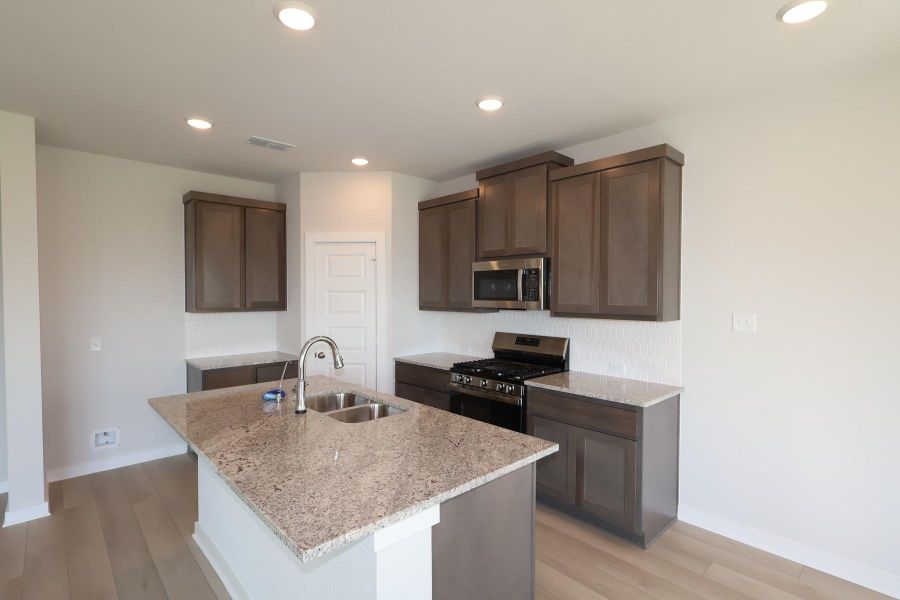 Furnished interior view inside a new home in Mason Woods, Cypress (Image 4).