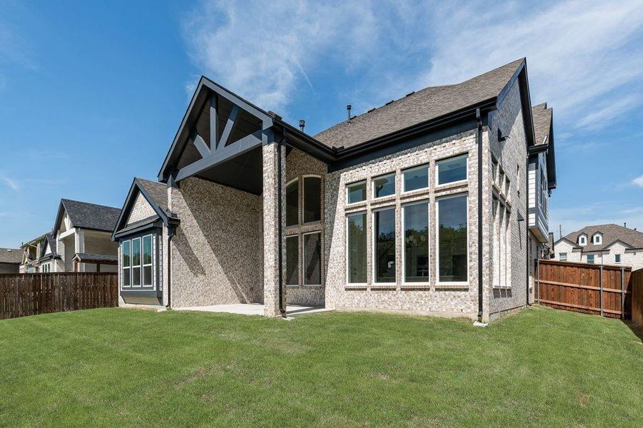 Front exterior of a new home in Breezy Hill, Rockwall, TX, highlighting curb appeal (Image 1). Front exterior of a new home in Breezy Hill, Rockwall, TX, highlighting curb appeal (Image 1).