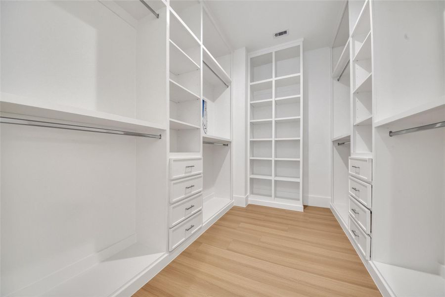 Custom built-in closet system in primary bath. Custom built-in closet system in primary bath.