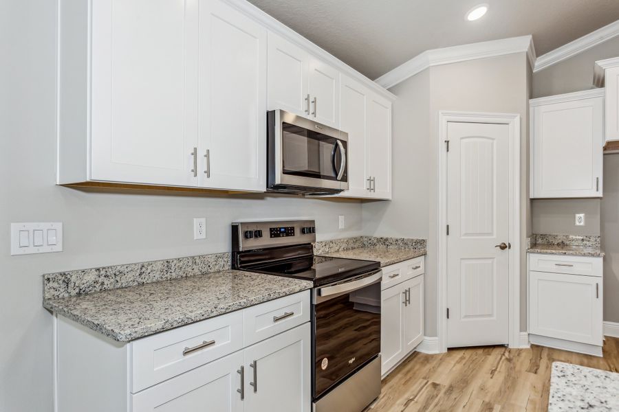 Representative furnished interior of a home built from the The Carlos by Herbst Homes in Doyle Hawkins Landing, Navarre (Image 63).