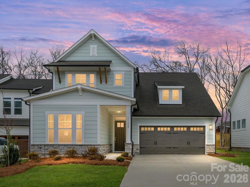Front exterior of a new home in North Creek Village, Huntersville, NC, highlighting curb appeal (Image 20). Front exterior of a new home in North Creek Village, Huntersville, NC, highlighting curb appeal (Image 20).