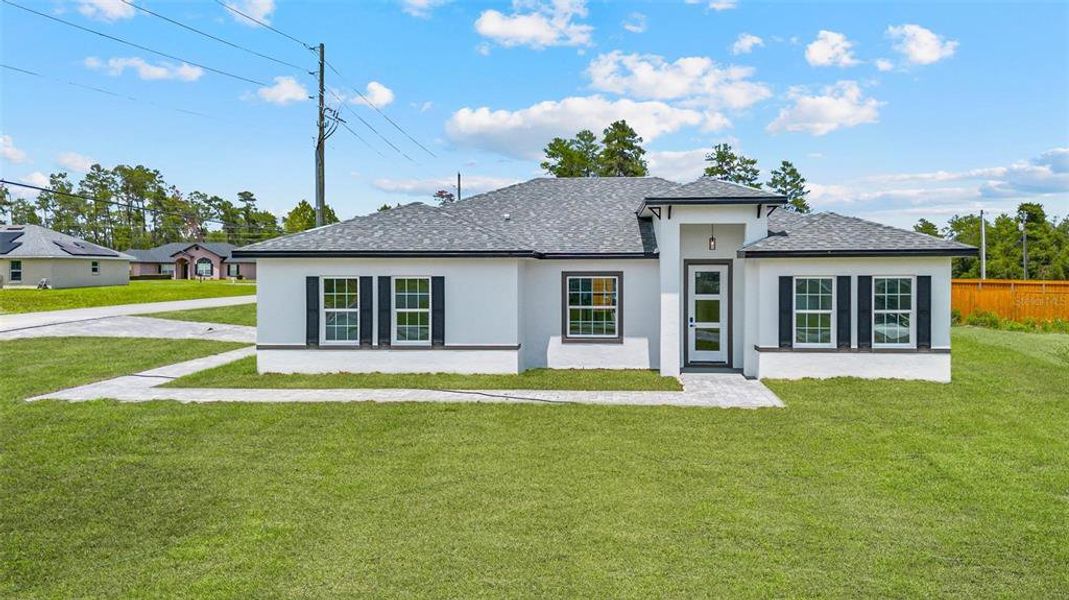 Front exterior of a new home in , Ocala, FL, highlighting curb appeal (Image 1).