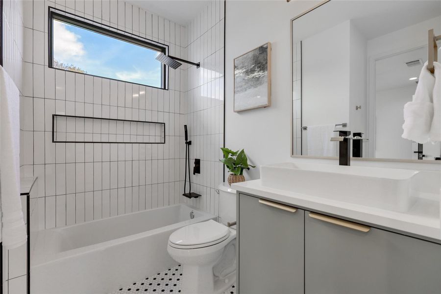 Bathroom featuring vanity and bathing tub / shower combination