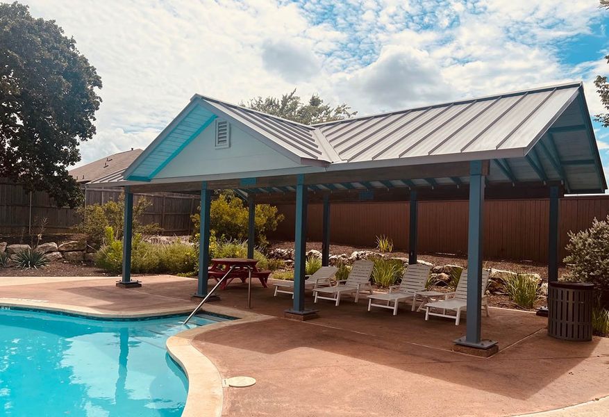 Front exterior of a new home in The Hills of Bear Creek, Manchaca, TX, highlighting curb appeal (Image 39).