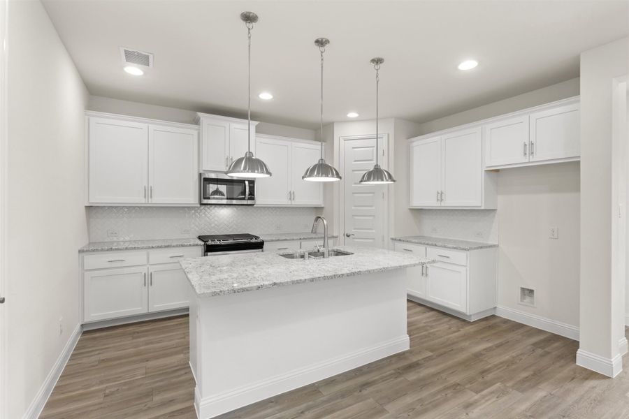 Representative furnished interior of a home built from the Juniper by UnionMain Homes in Edgewater, Fate (Image 7).