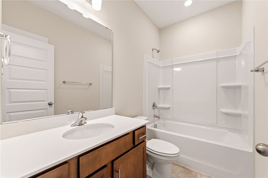 A well-appointed bathroom features a single vanity