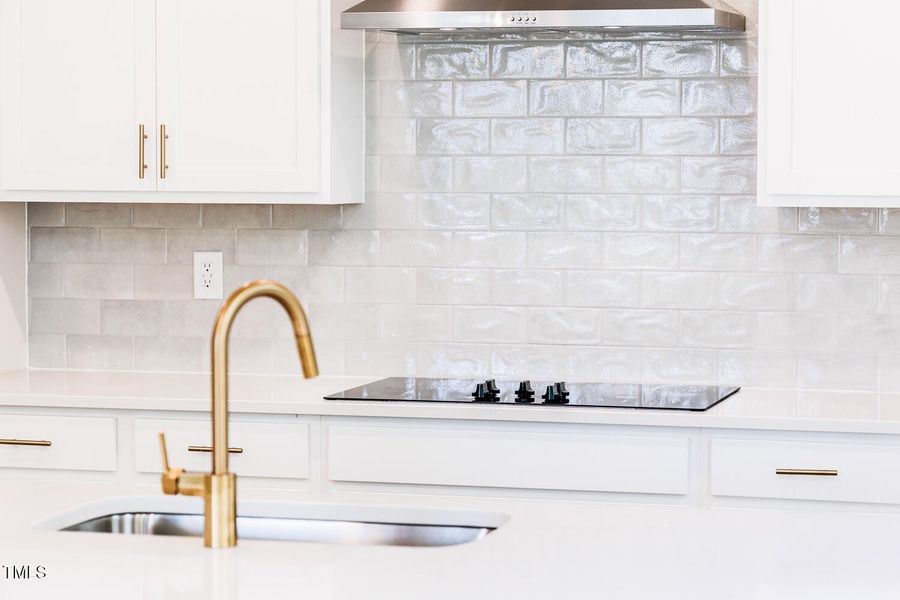 Backsplash and faucet