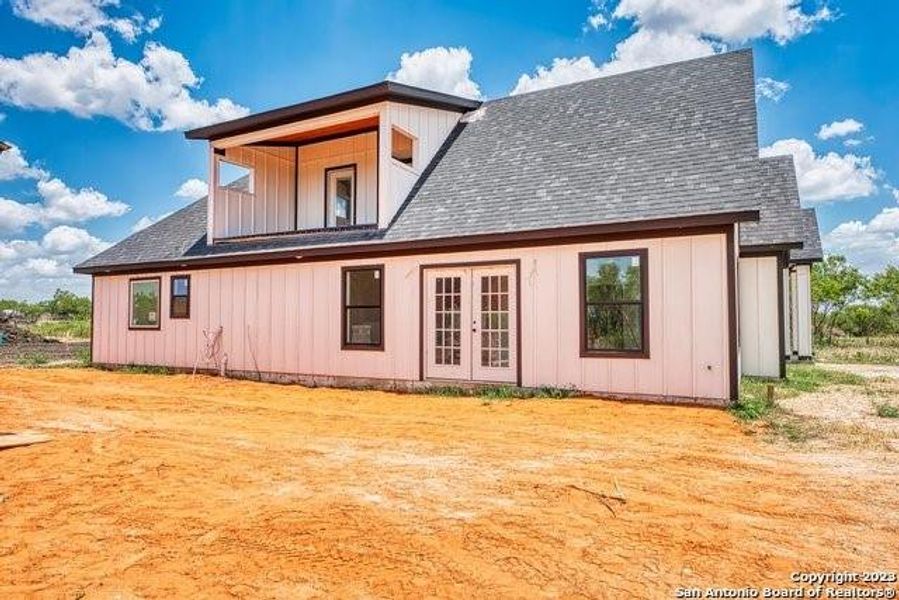 Back of house with french doors